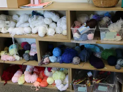 balls of yarn on shelf