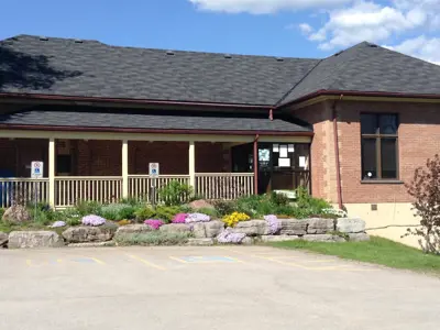 entrance to buckhorn library with flower beds